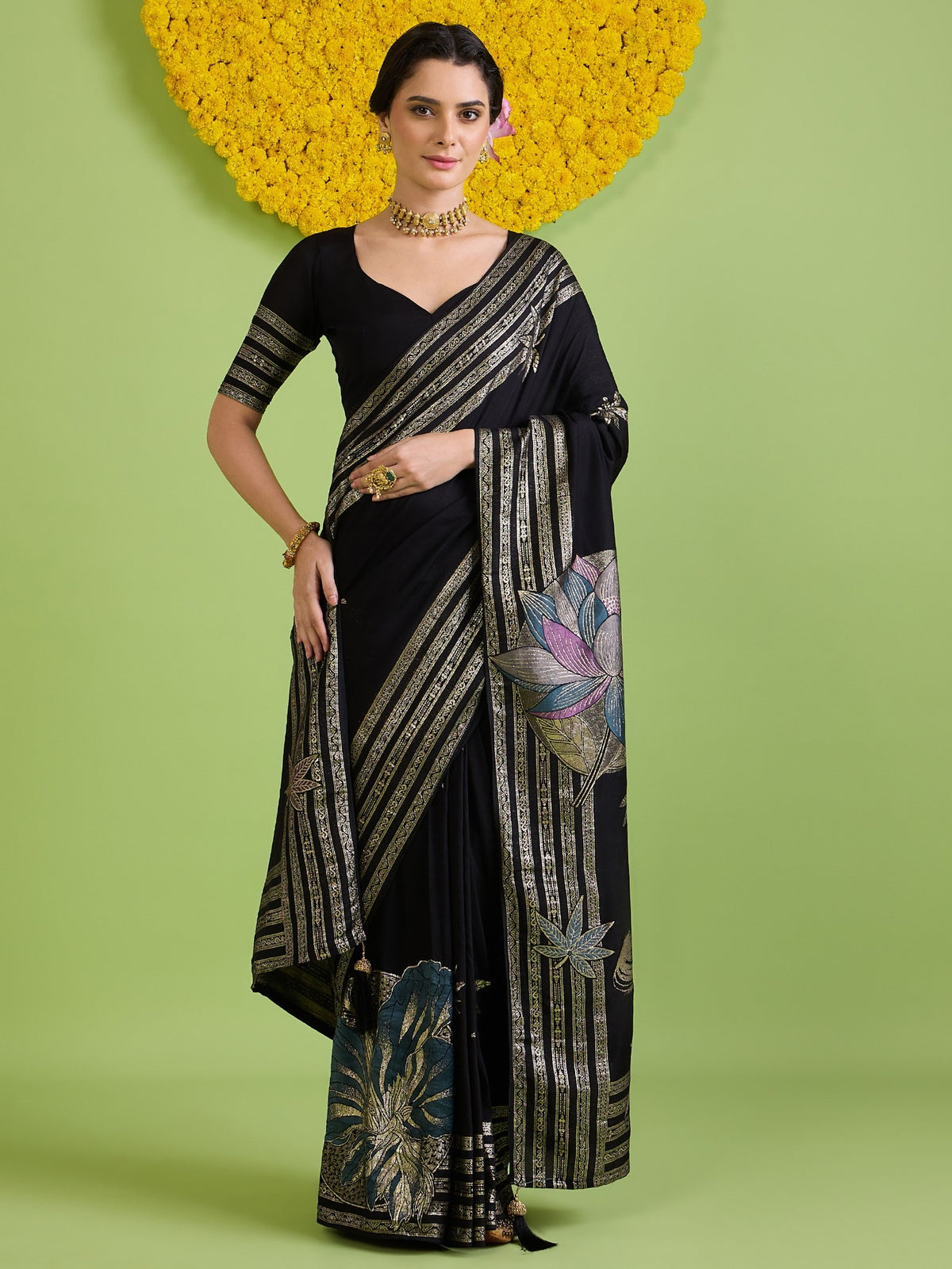 Woman wearing black silk blend saree with woven motif design and black blouse