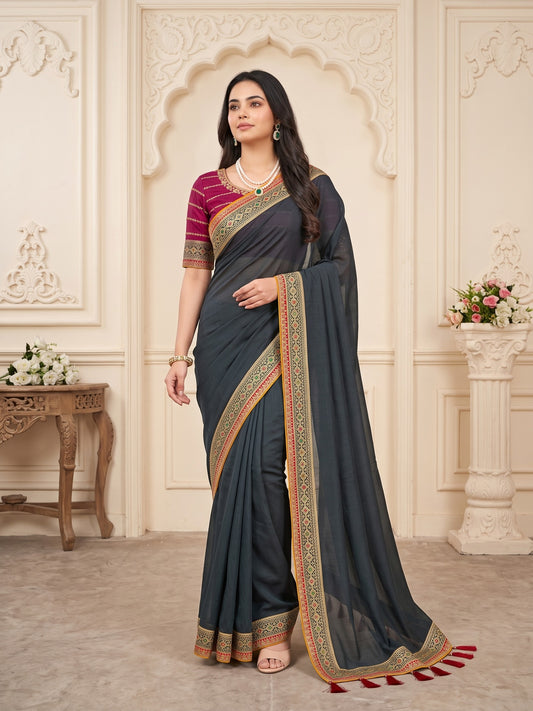 Woman wearing green vichitra silk saree with clean solid-tone finish and pink blouse