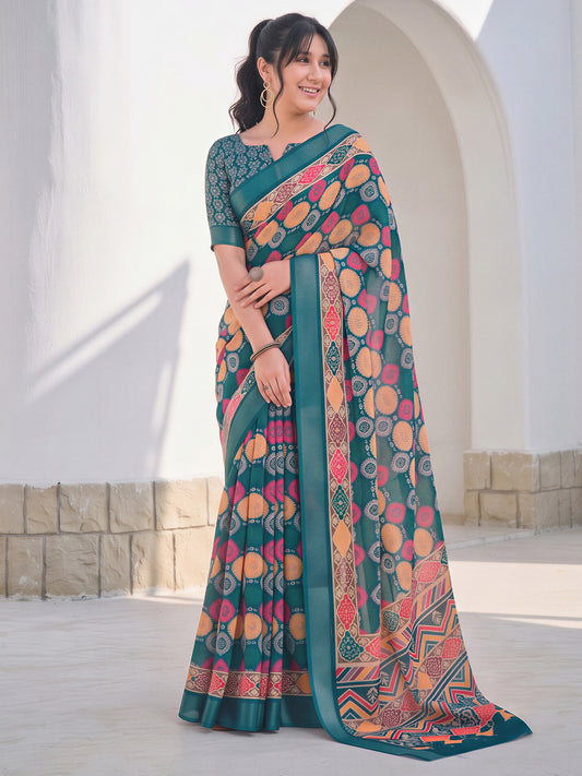 Woman wearing teal blue cotton linen saree with traditional indian motif work and teal blue blouse