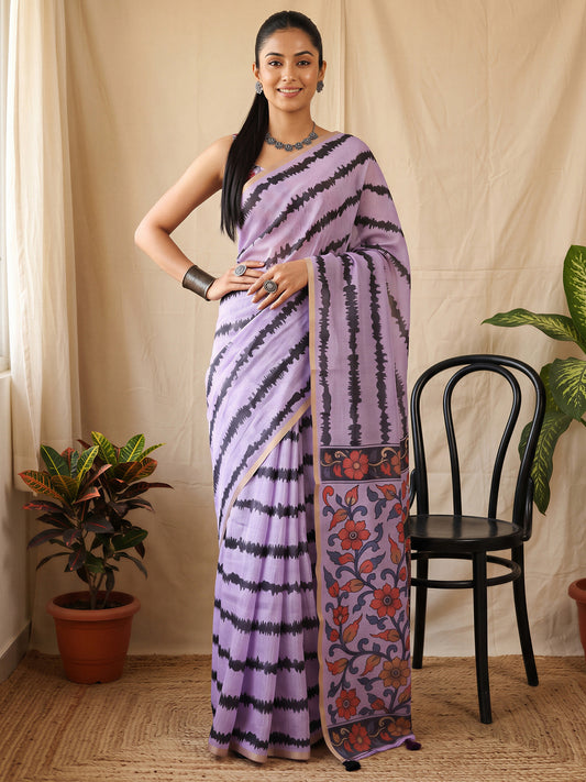 Woman wearing lavender cotton blend saree with kalamkari narrative motif work and lavender blouse