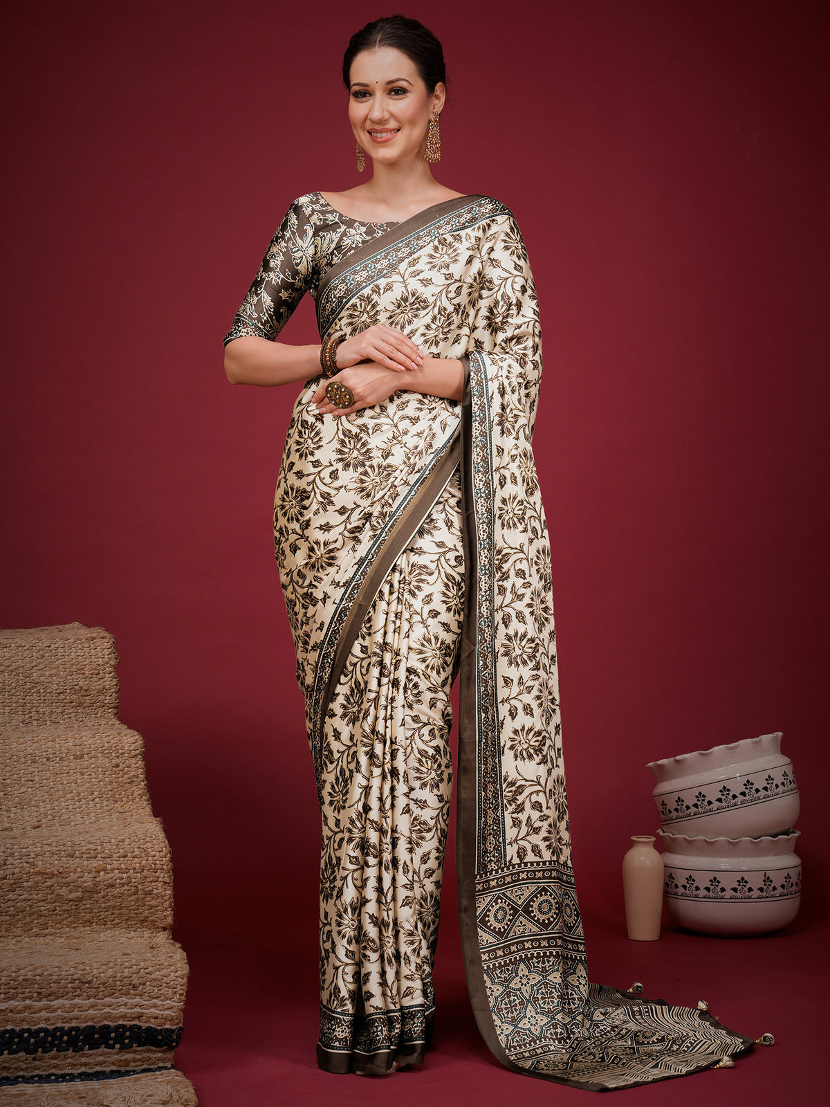Woman wearing cream satin saree with ajrak block-print motif work and brown blouse