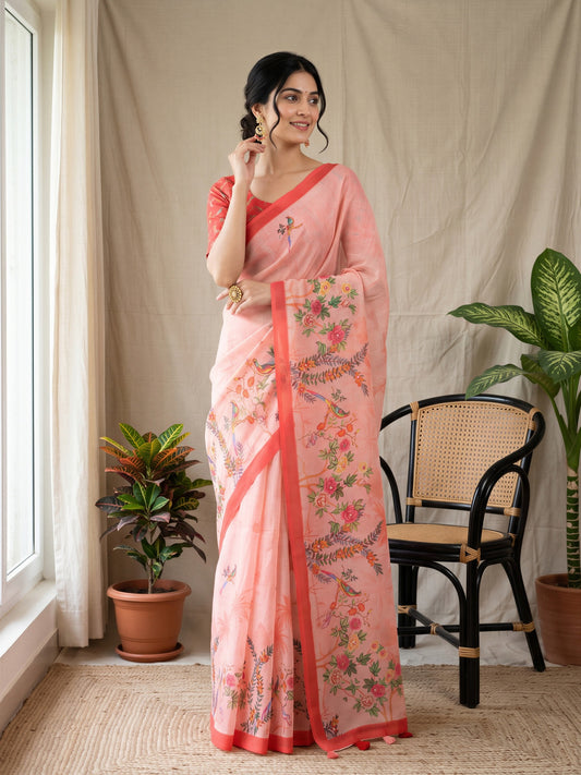 Woman wearing pink linen blend saree with kalamkari narrative motif work and orange blouse