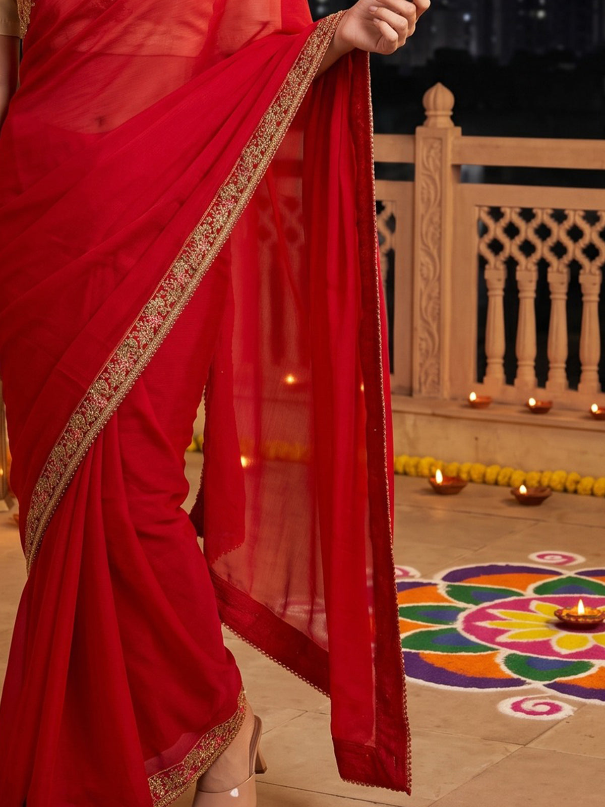 Pallu detail of red satin silk saree showing ornamented surface design and zari border