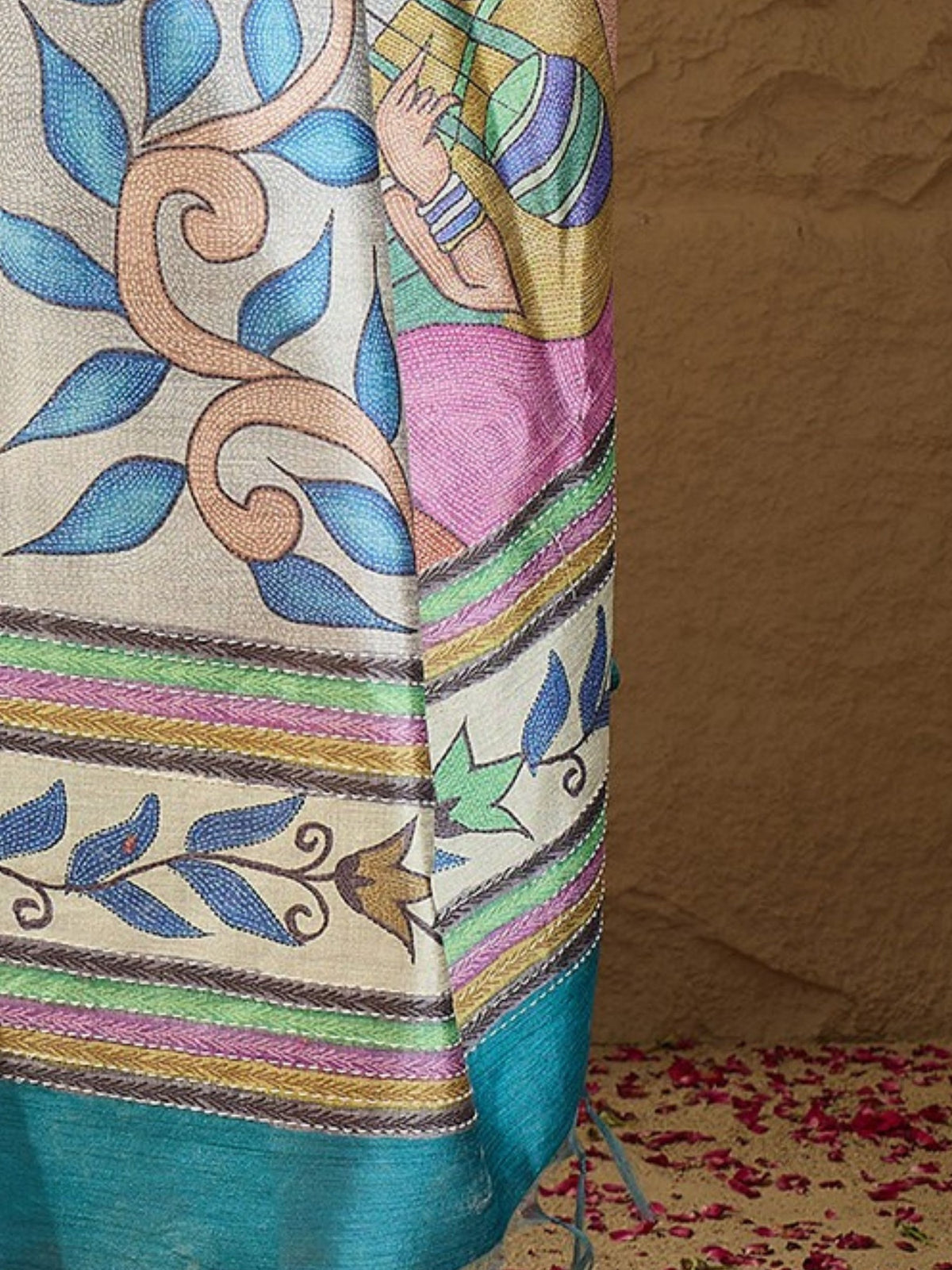 Pallu detail of multicolored art silk saree showing kalamkari narrative motif work and printed border