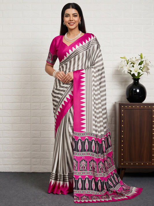 Woman wearing pink satin saree with striped pattern design and pink blouse