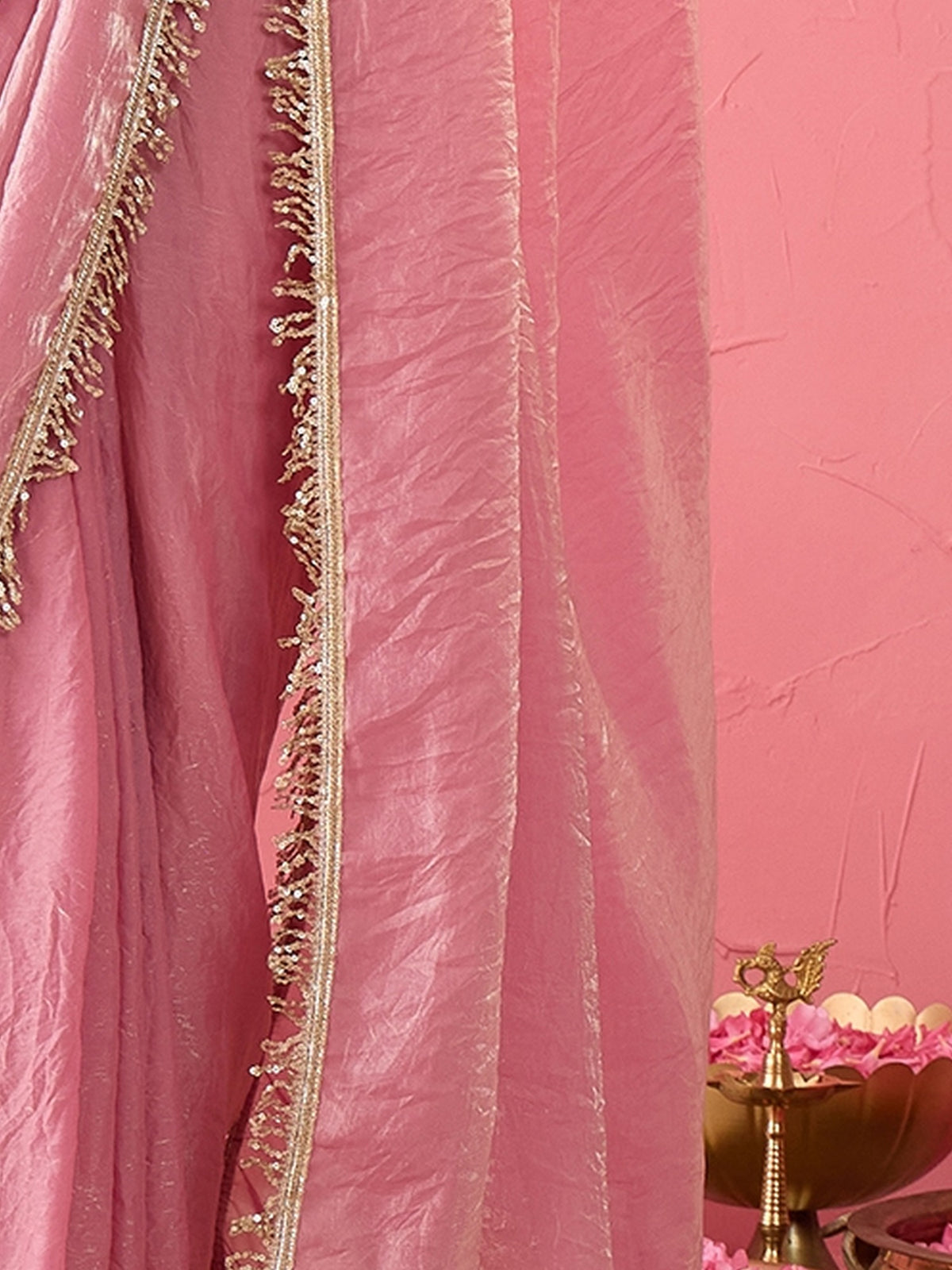 Pallu detail of mauve paper silk saree showing ornamented surface design and embellished border