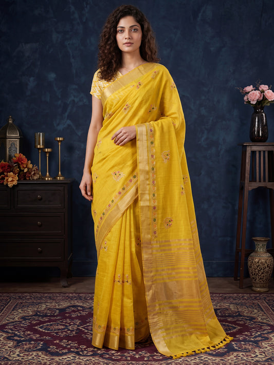 Woman wearing yellow cotton linen saree with embroidered motif work and yellow blouse