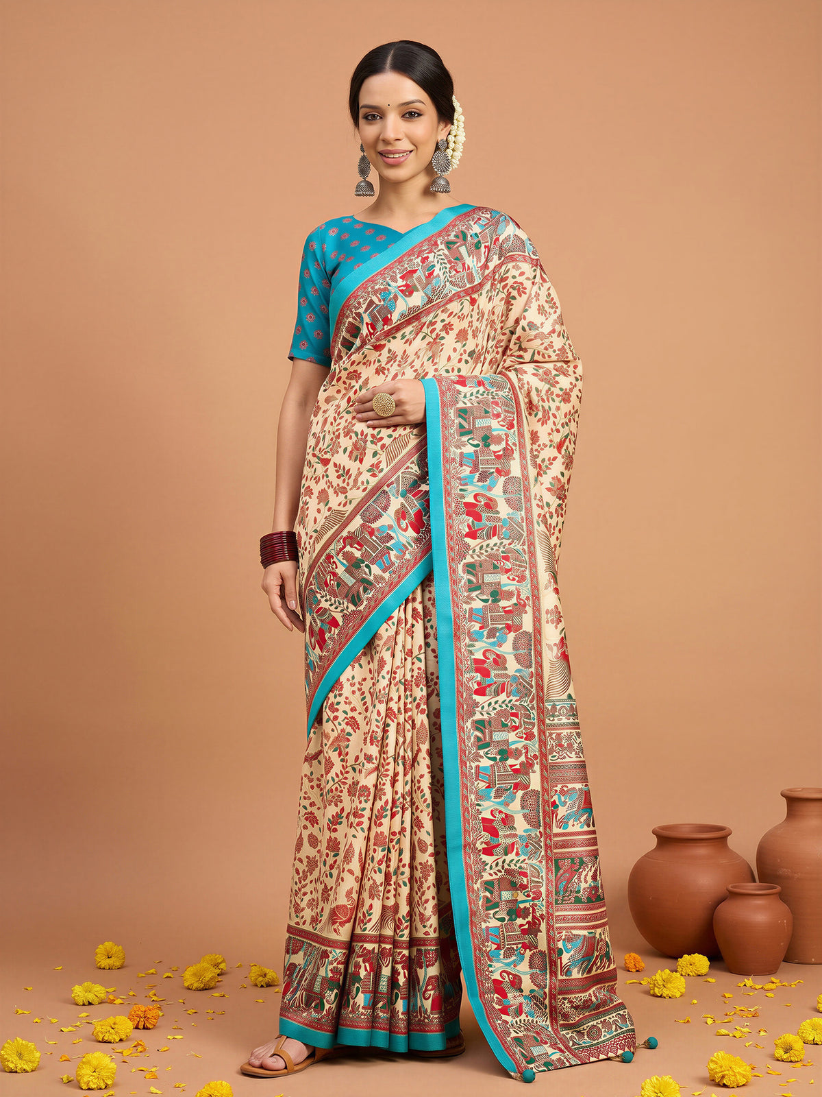 Woman wearing assorted silk blend saree with metallic foil print work and teal blue blouse