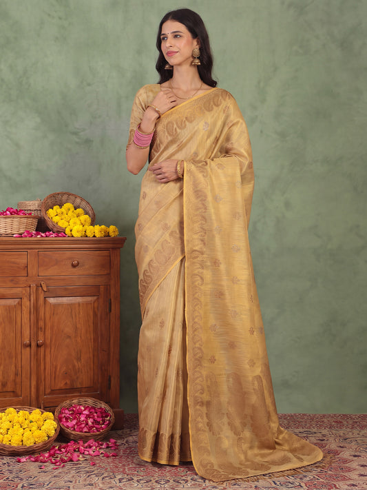 Woman wearing cream linen saree with traditional indian motif work and cream blouse