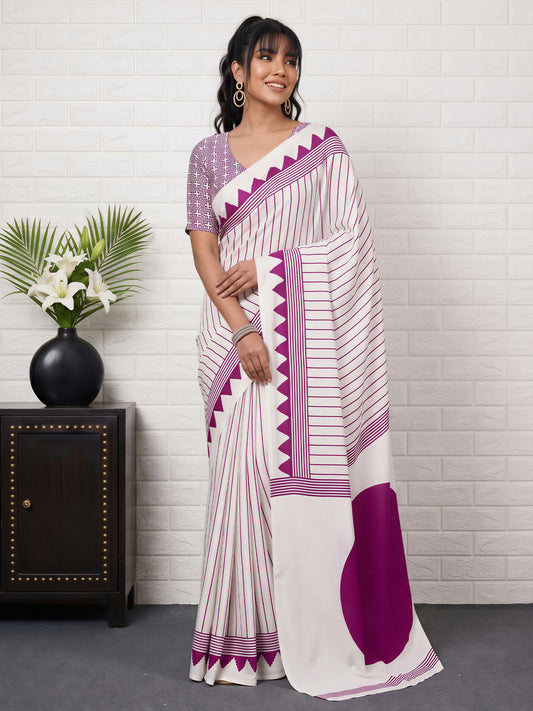 Woman wearing white satin saree with striped pattern design and white blouse