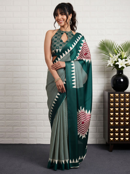 Woman wearing green satin silk saree with striped pattern design and green blouse
