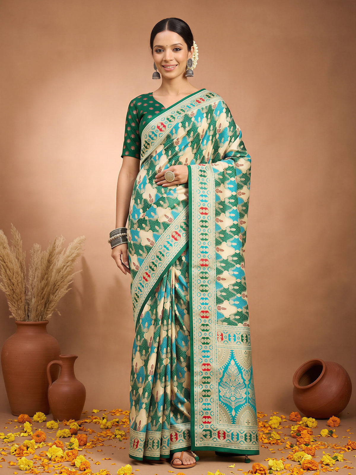Woman wearing green silk blend saree with metallic foil print work and green blouse