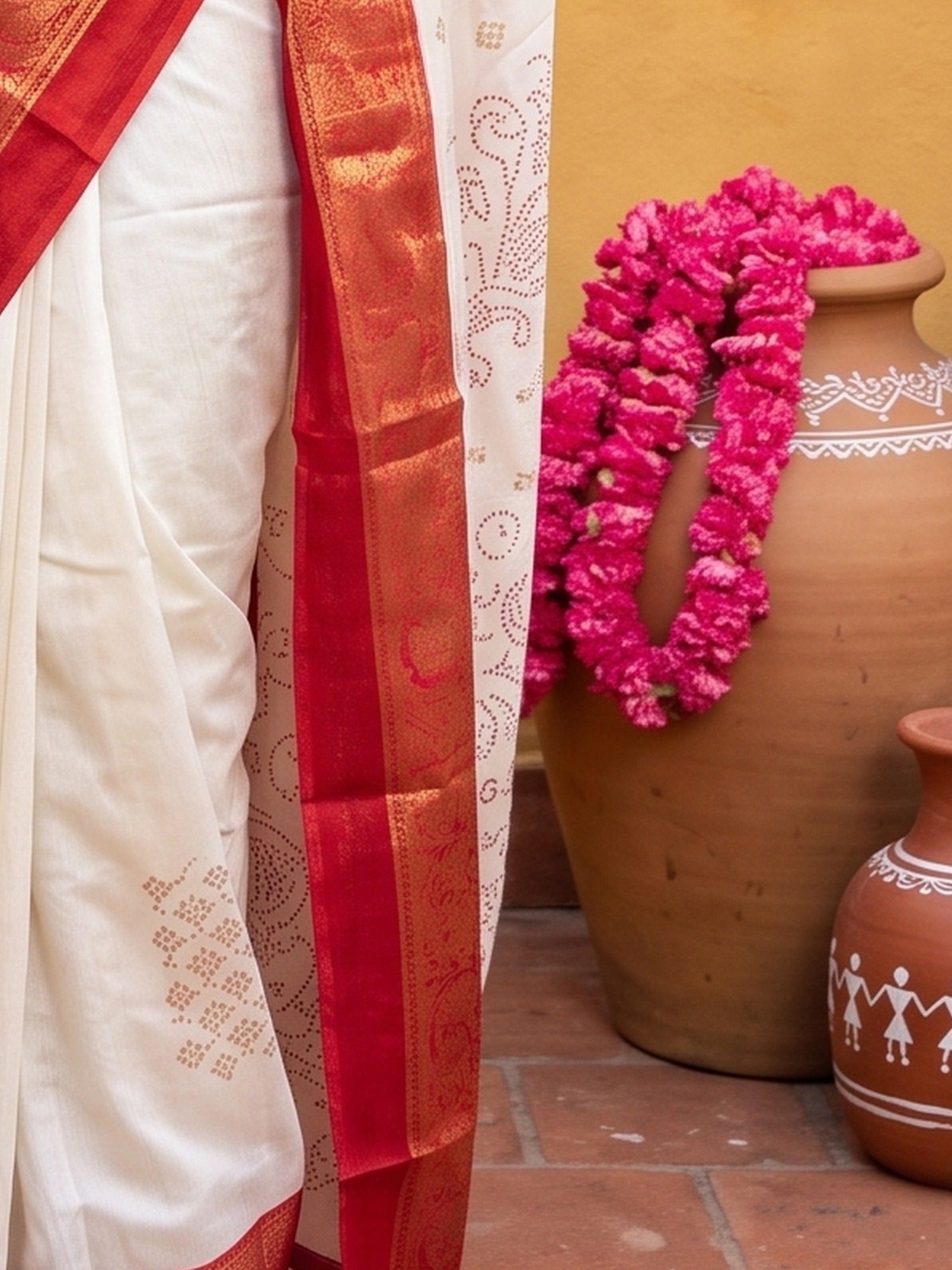 Pallu detail of offwhite silk blend saree showing geometric pattern design and printed border