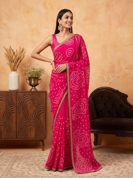Woman wearing pink georgette saree with bandhani tie-dye dot work and pink blouse