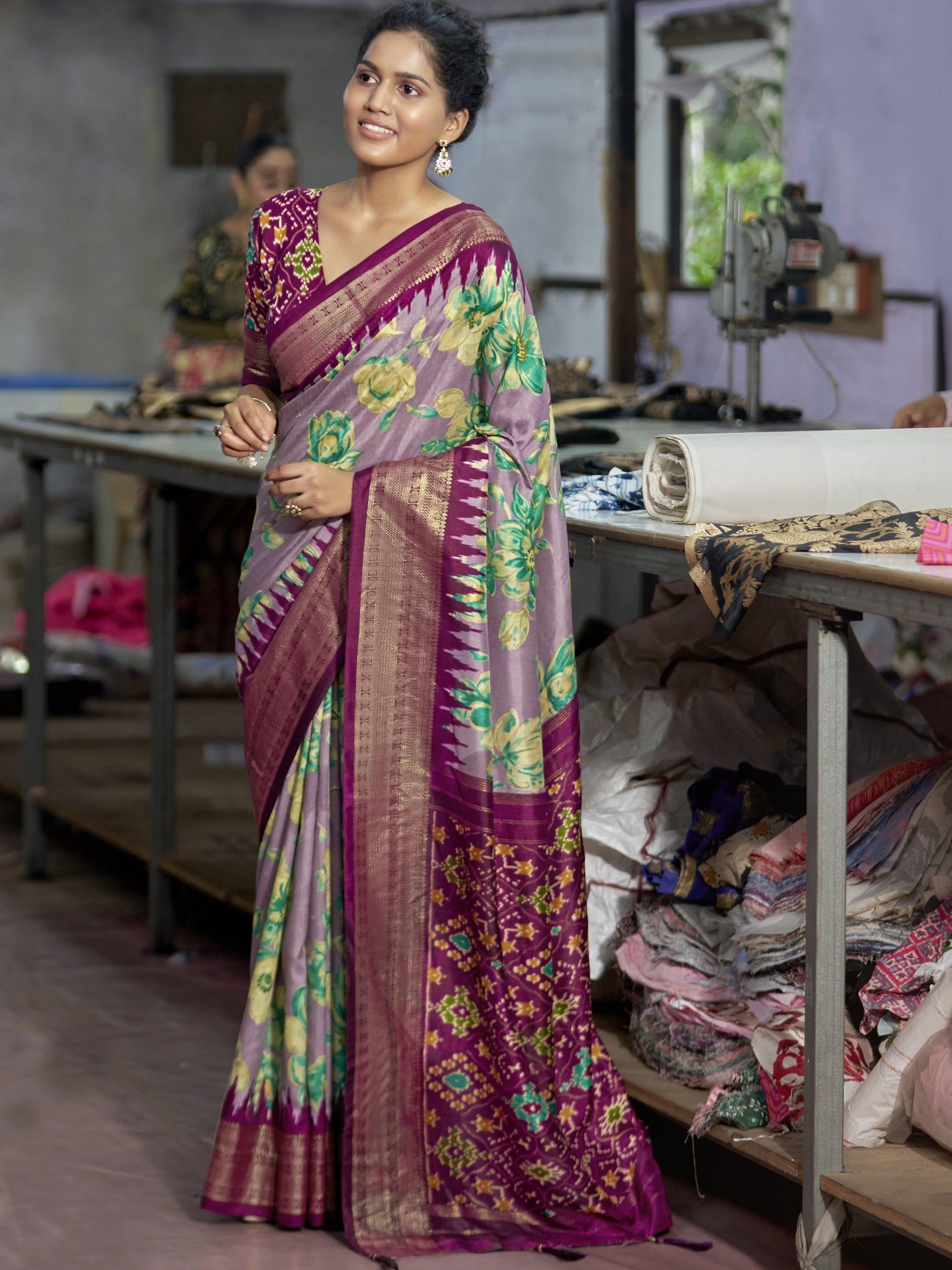 Woman wearing mauve tussar silk saree with ikat resist-dyed pattern and wine blouse