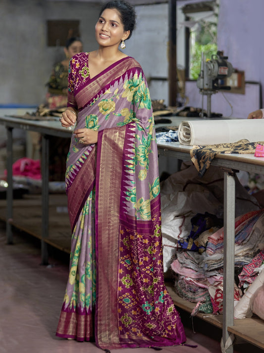 Woman wearing mauve tussar silk saree with ikat resist-dyed pattern and wine blouse