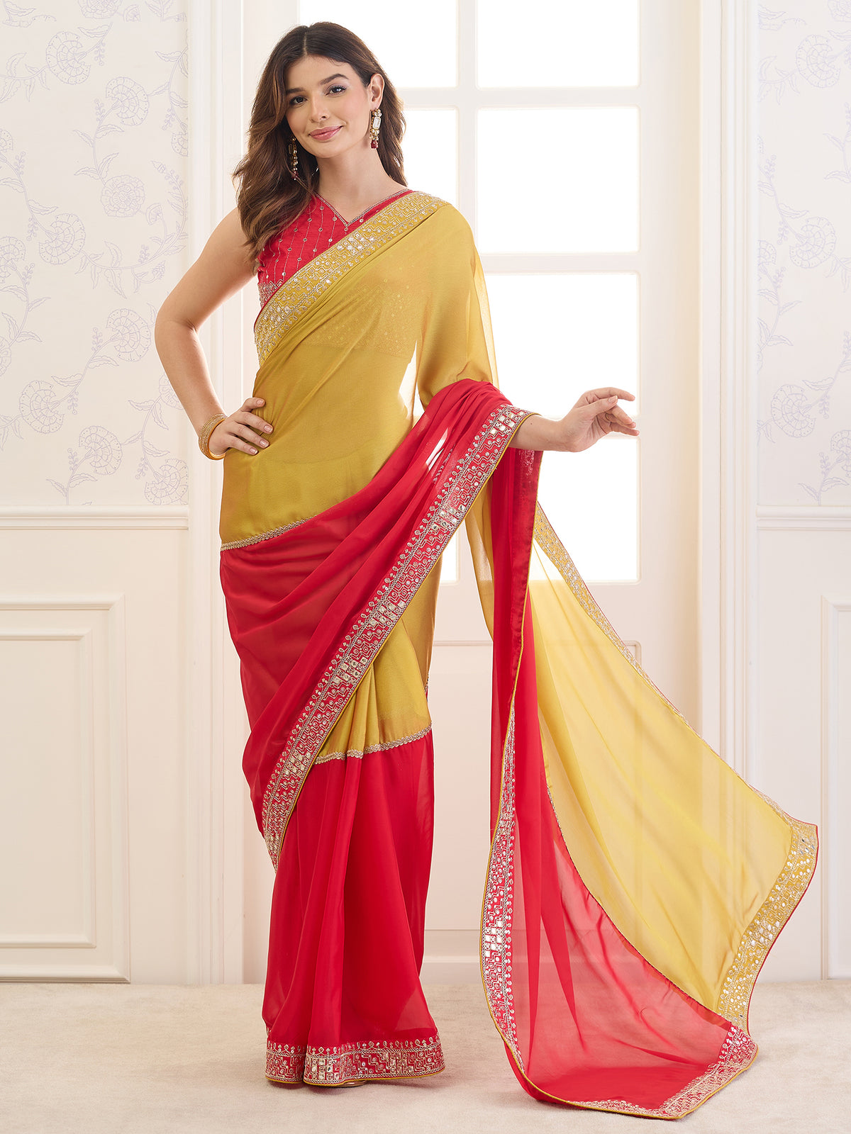 Woman wearing red pure georgette saree with ornamented surface design and red blouse