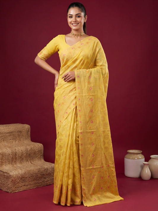 Woman wearing yellow silk blend saree with zari butta (metallic motif) work and yellow blouse