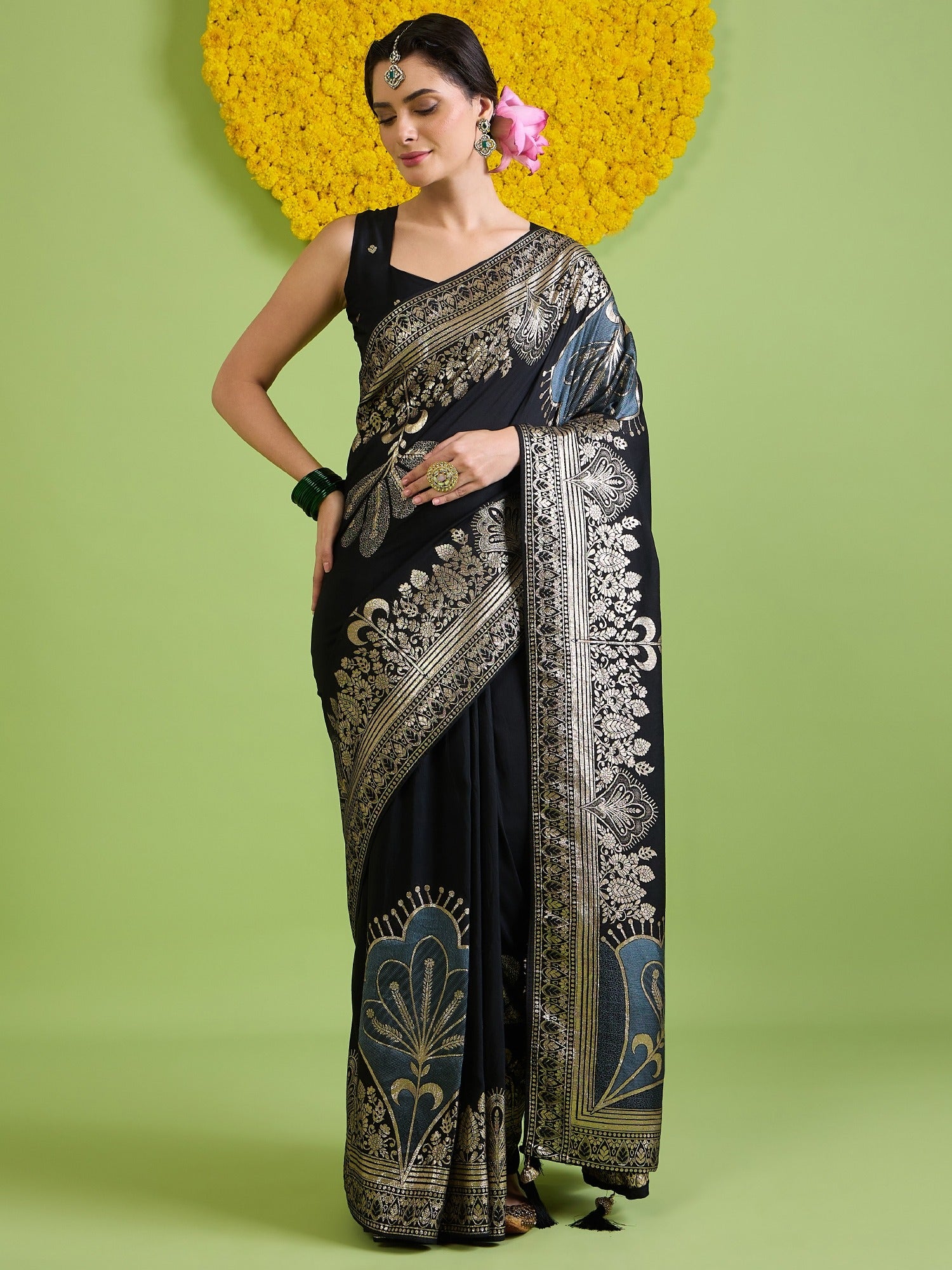 Woman wearing black silk blend saree with woven motif design and black blouse