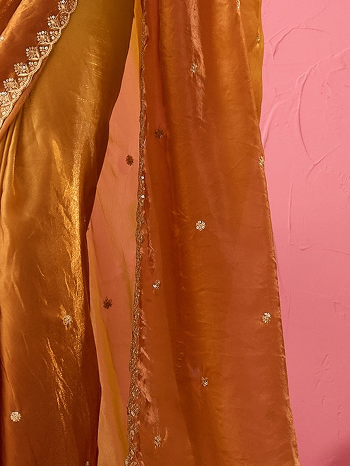 Pallu detail of bronze paper silk saree showing embroidered motif work and embroidered border