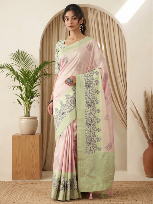 Woman wearing pink silk blend saree with traditional indian motif work and light green blouse