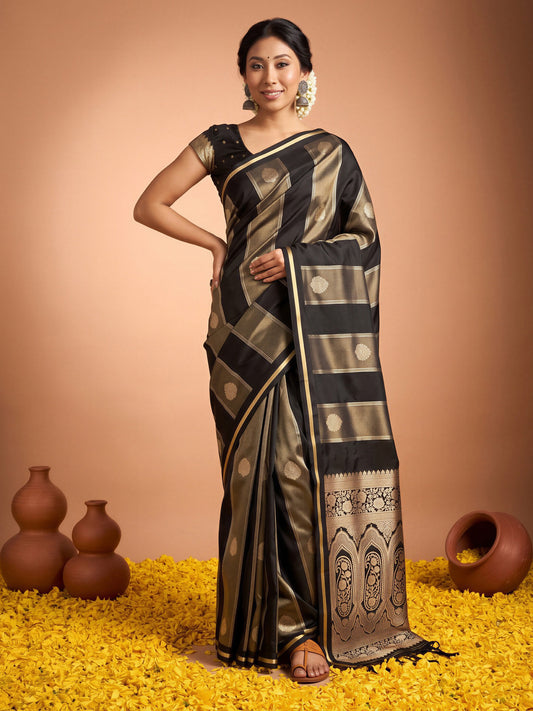 Woman wearing black satin saree with traditional indian motif work and black blouse