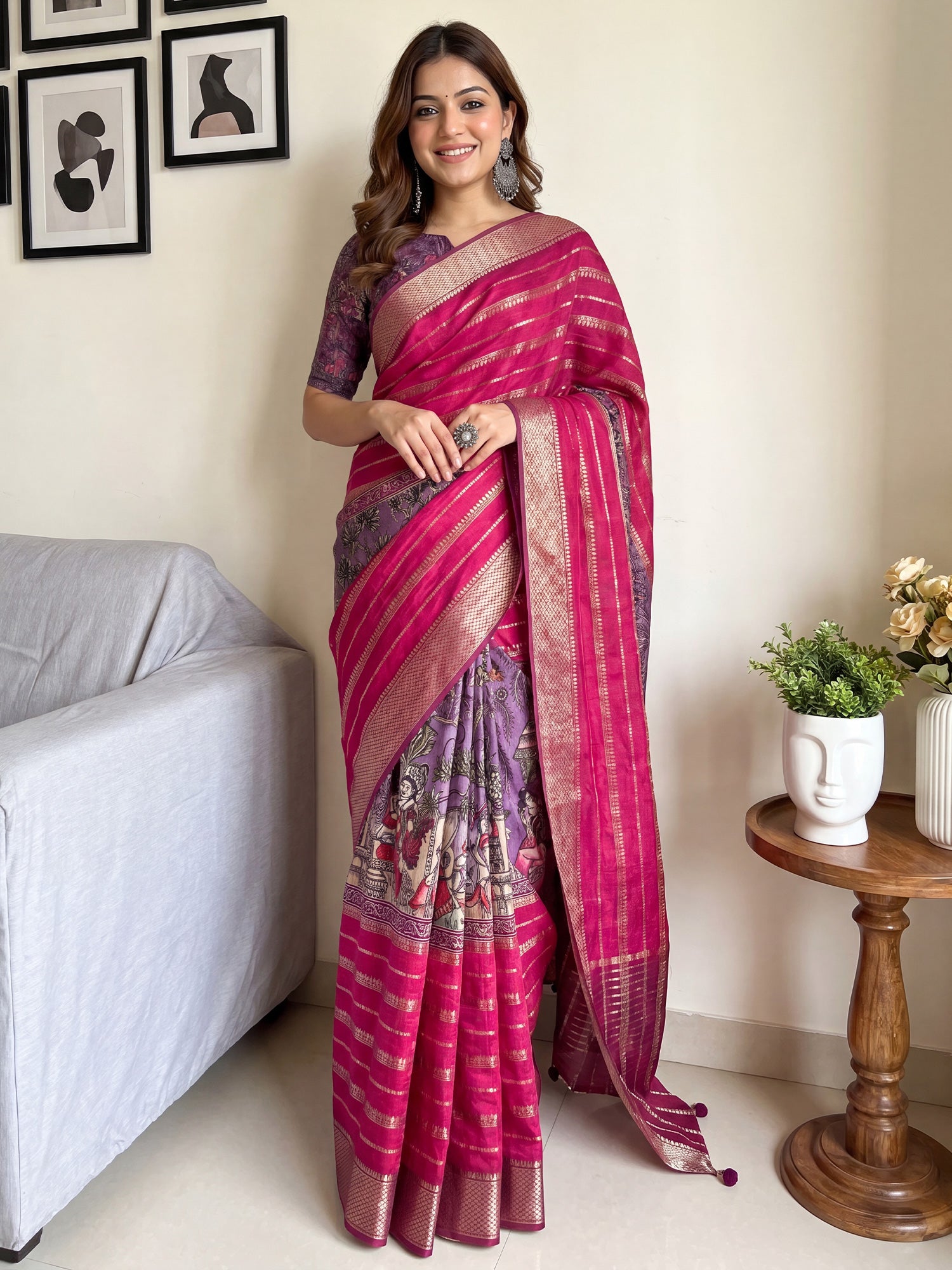 Woman wearing pink viscose silk saree with traditional indian motif work and purple blouse
