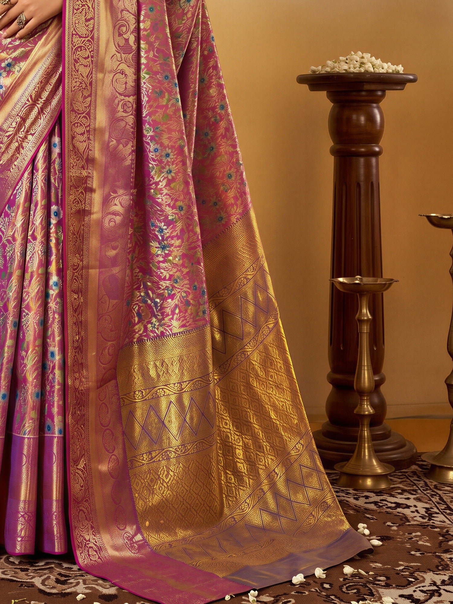 Pallu detail of mauve silk blend saree showing traditional indian motif work and zari border