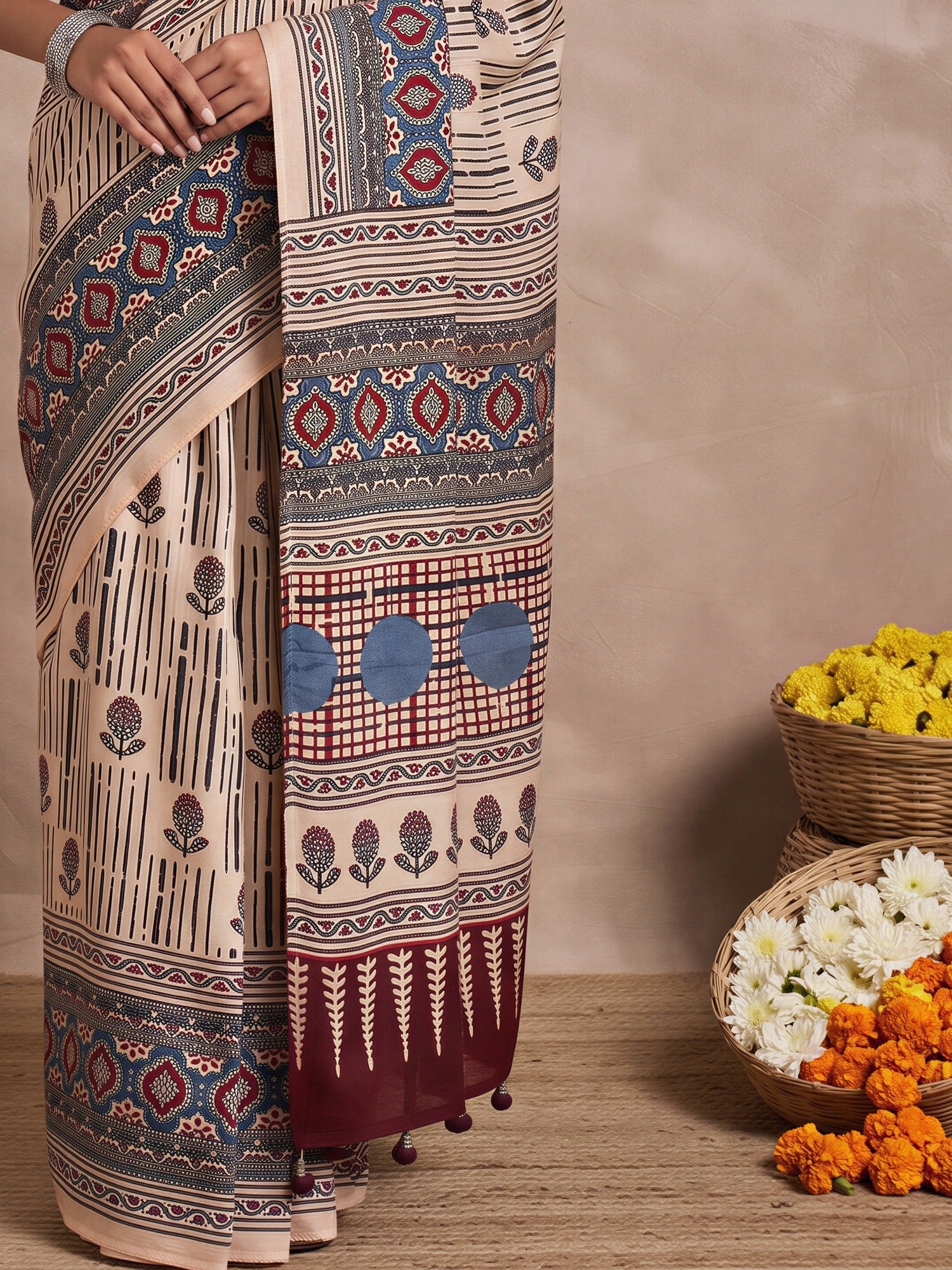 Pallu detail of cream viscose silk saree showing ajrak block-print motif work and printed border