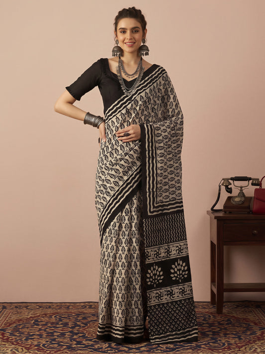 Woman wearing beige bhagalpuri silk saree with batik wax-resist design and black blouse