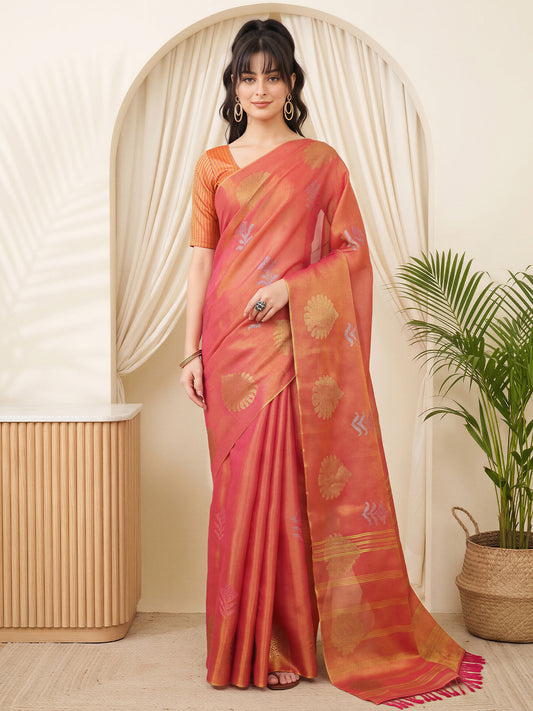 Woman wearing orange linen saree with traditional indian motif work and orange blouse