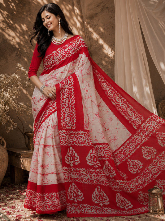 Woman wearing off white bhagalpuri silk saree with tie-and-dye resist pattern and red blouse