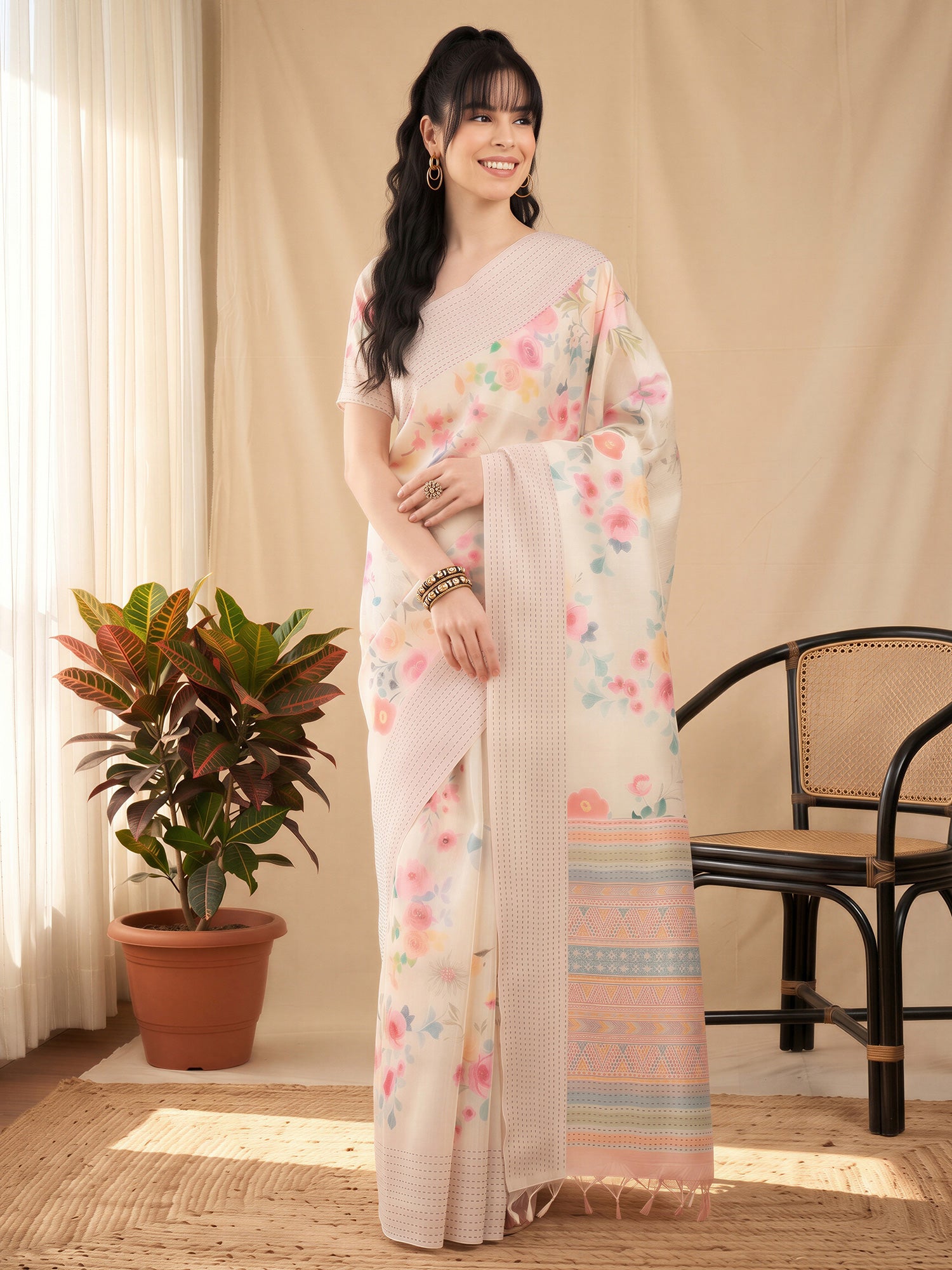 Woman wearing off white silk cotton saree with botanical floral and leaf design and off white blouse