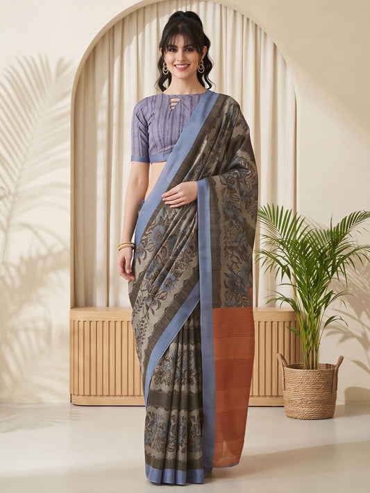 Woman wearing grey cotton blend saree with all-over floral design and light blue blouse