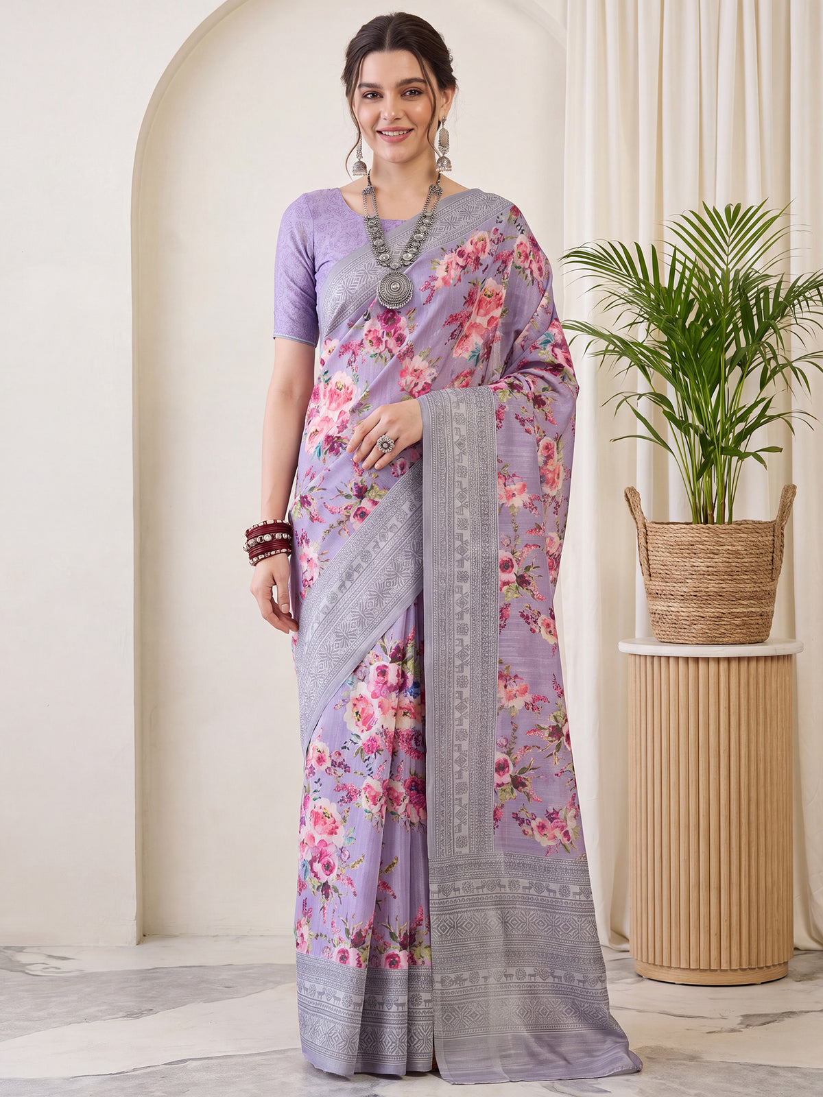 Woman wearing lavender silk blend saree with botanical floral and leaf design and lavender blouse