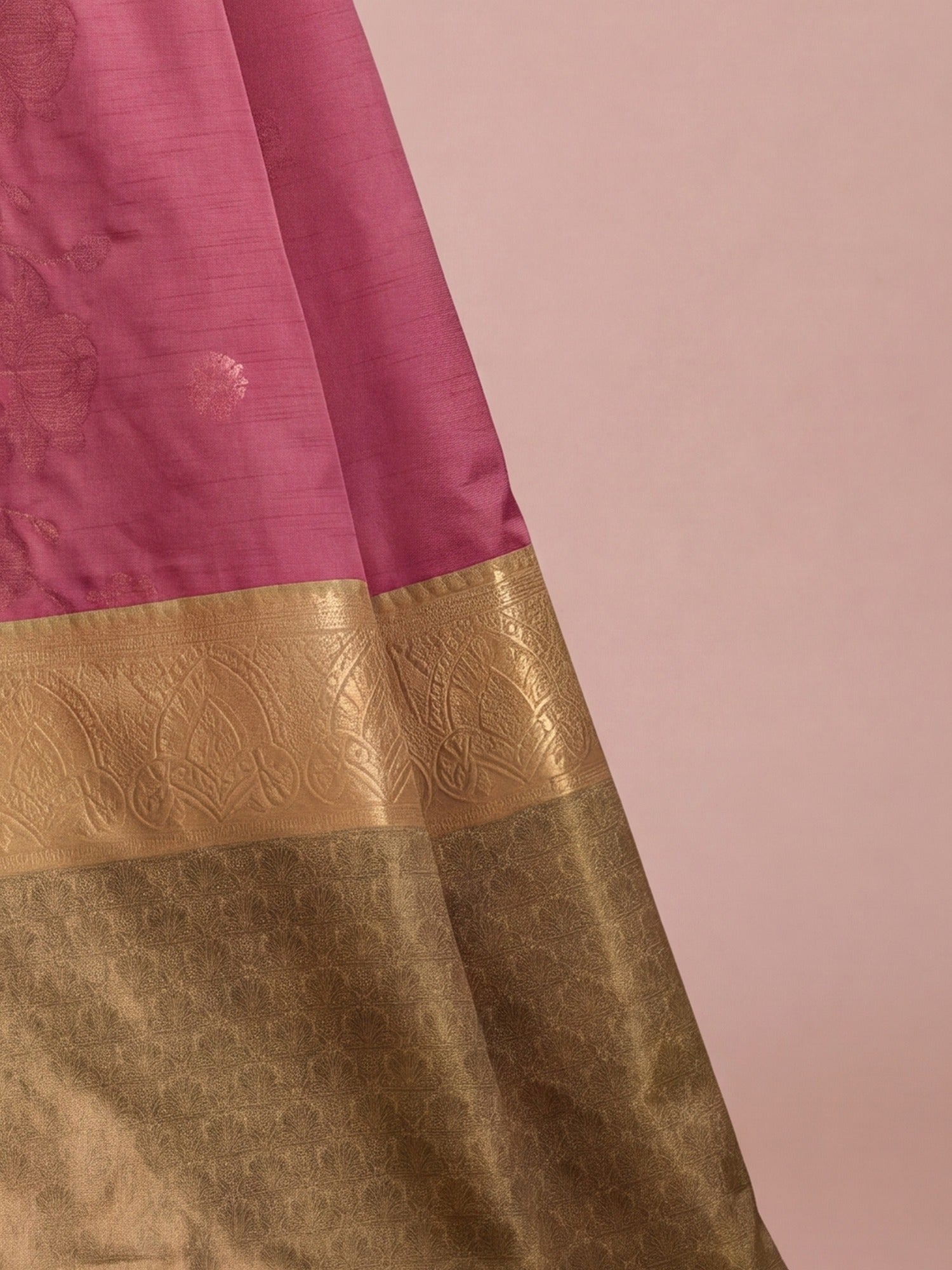 Pallu detail of mauve tussar silk saree showing traditional indian motif work and zari border