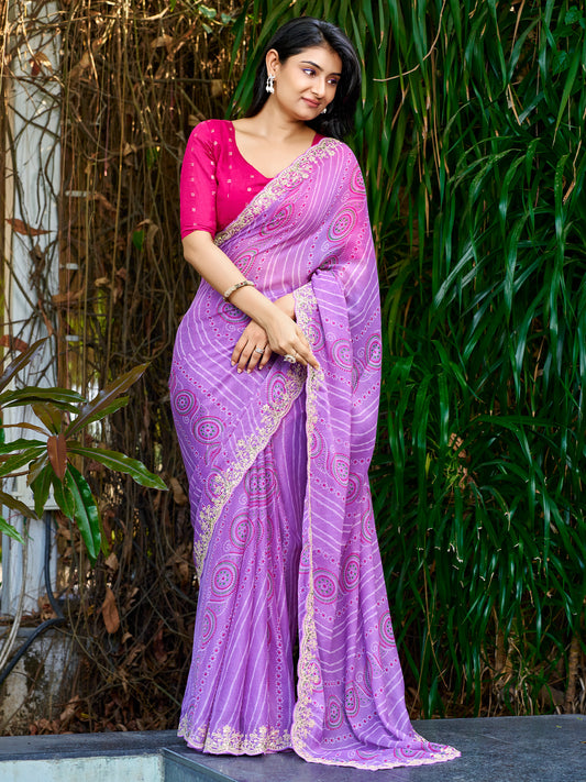 Woman wearing lavender georgette saree with bandhani tie-dye dot work and pink blouse