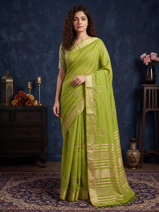 Woman wearing lime green cotton linen saree with embroidered motif work and lime green blouse