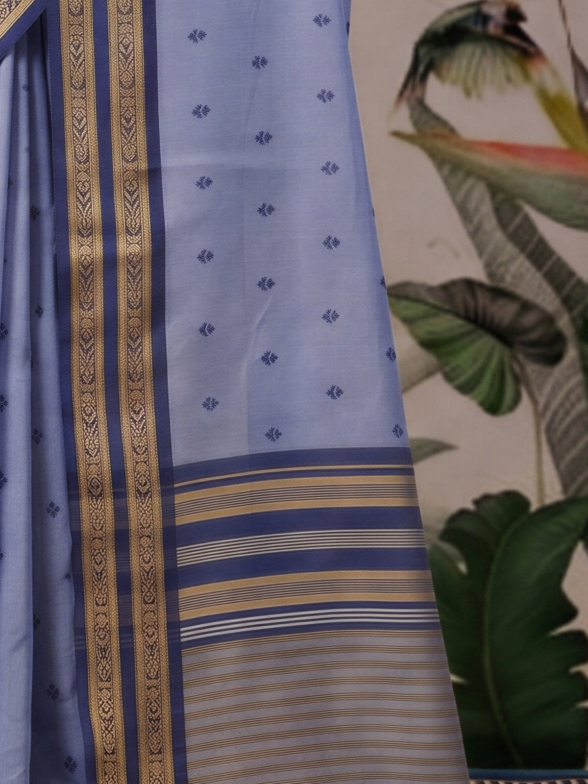 Pallu detail of light blue cotton blend saree showing woven motif design and zari border