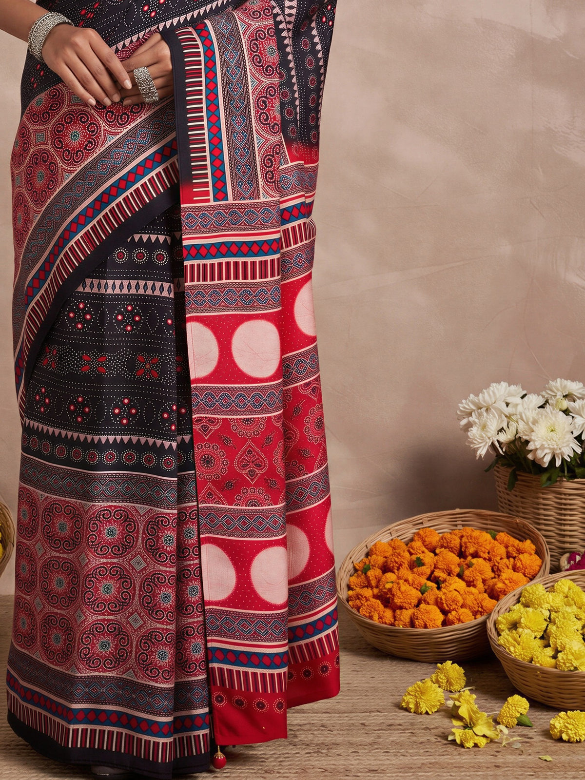 Pallu detail of black viscose silk saree showing ajrak block-print motif work and printed border