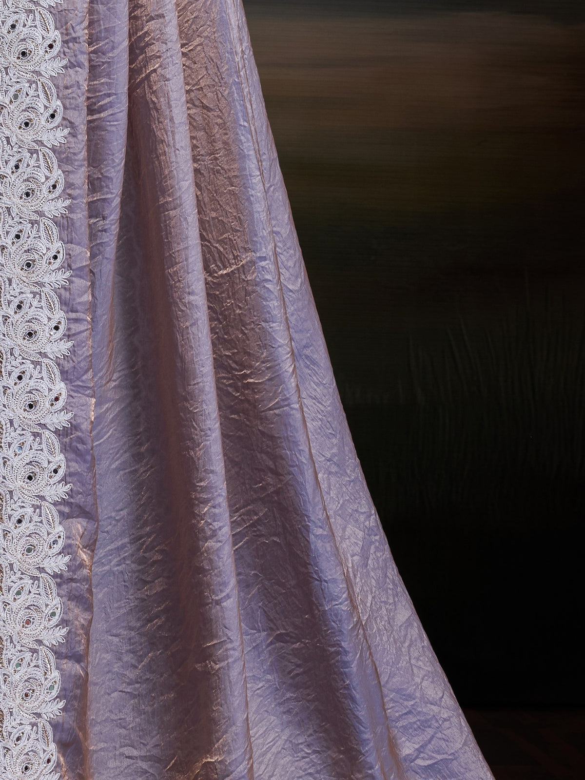 Pallu detail of lavender satin silk saree showing clean solid-tone finish and scallop border