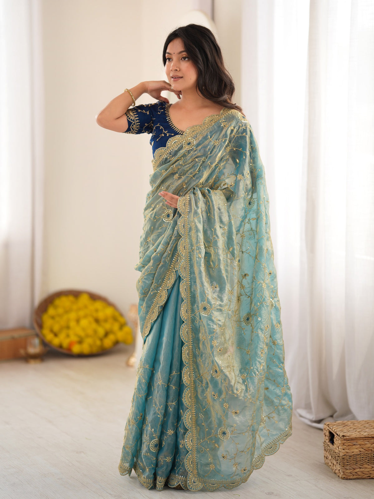 Light Blue embellished organza saree with teal blue blouse piece