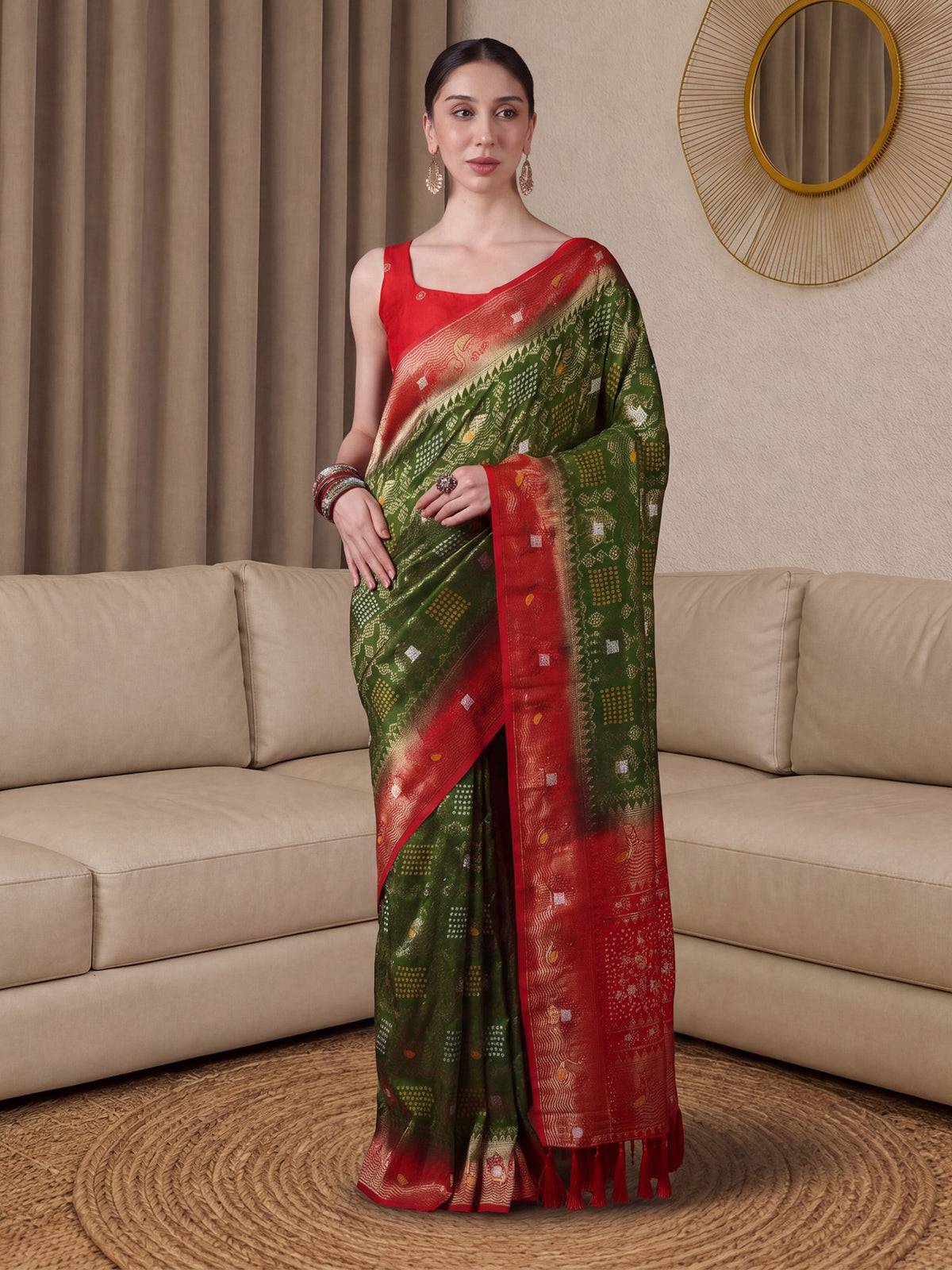 Woman wearing light green dola silk saree with bandhani tie-dye dot work and red blouse