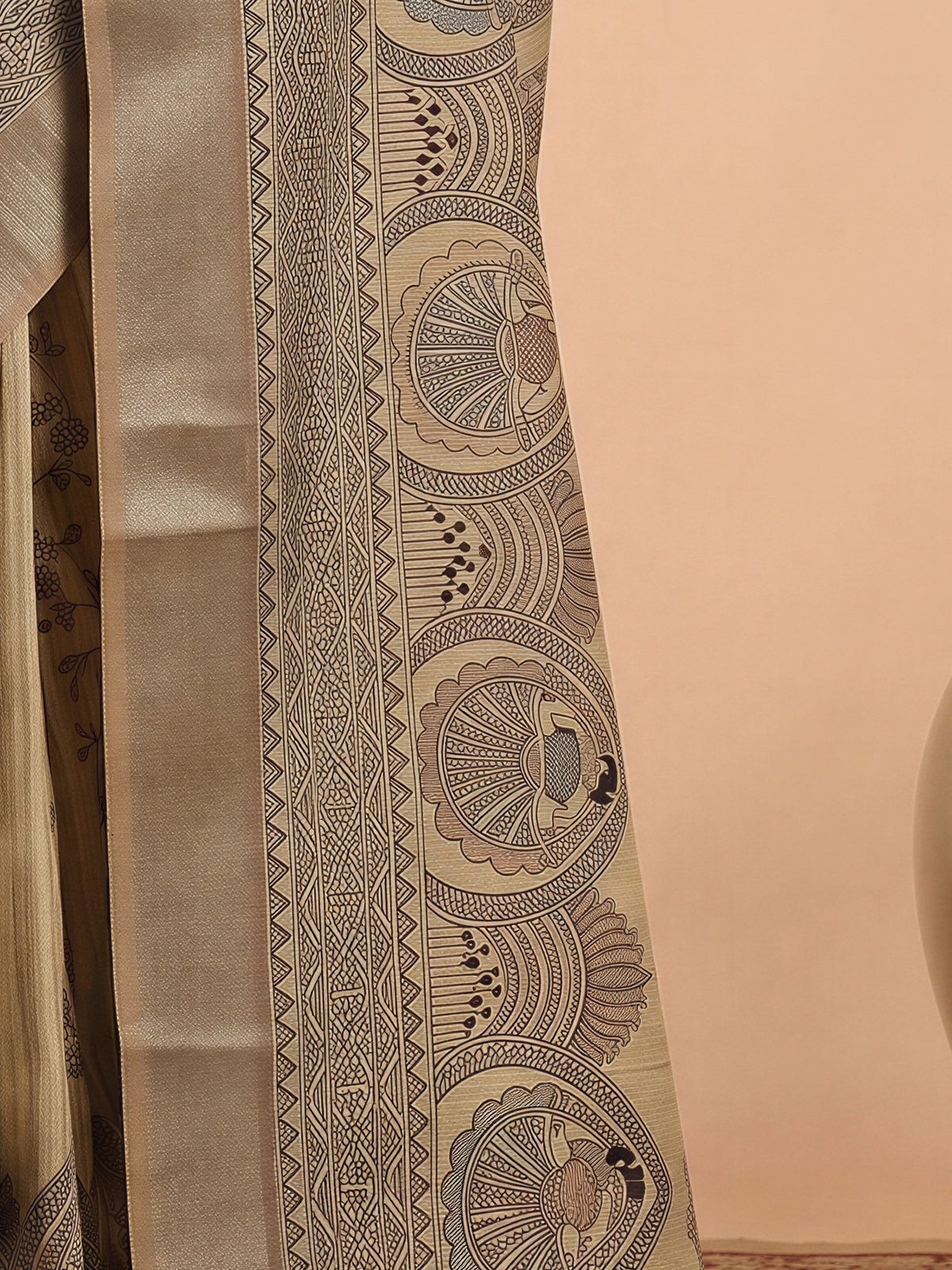 Pallu detail of cream satin silk saree showing hand block-printed motifs and zari border