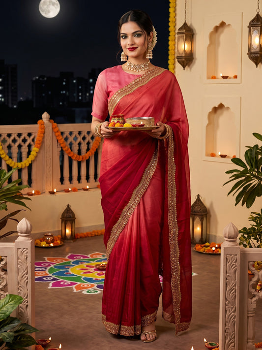 Woman wearing red satin saree with ombre graded colour work and red blouse
