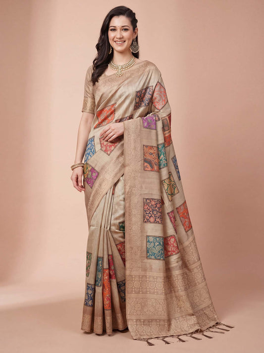 Woman wearing beige cotton silk saree with traditional indian motif work and beige blouse