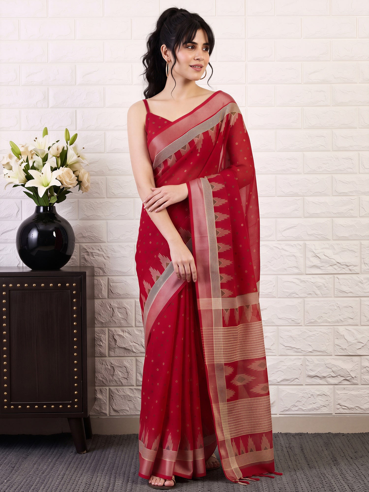Woman wearing red cotton linen saree with bagru hand block-print work and red blouse