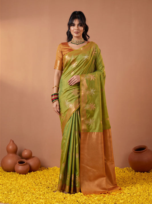 Woman wearing light green tussar silk saree with traditional indian motif work and mustard blouse