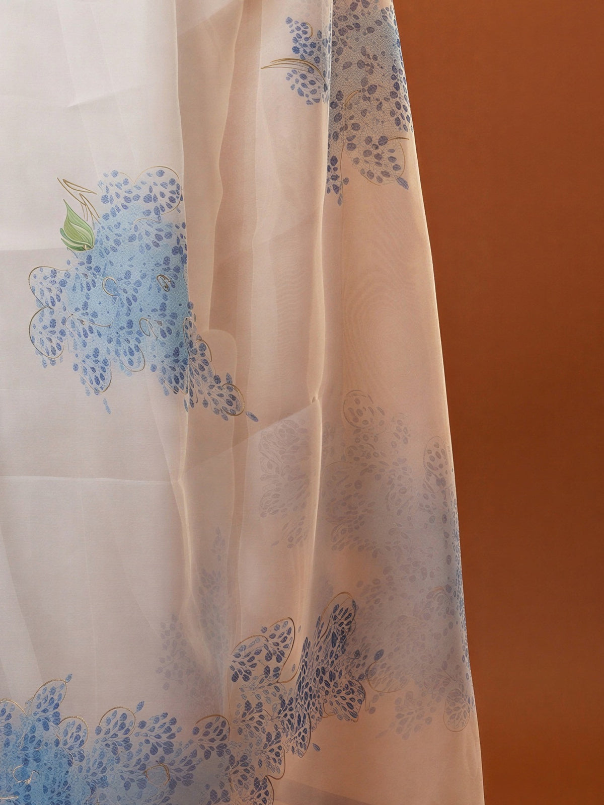 Pallu detail of white organza saree showing abstract contemporary design and zari border