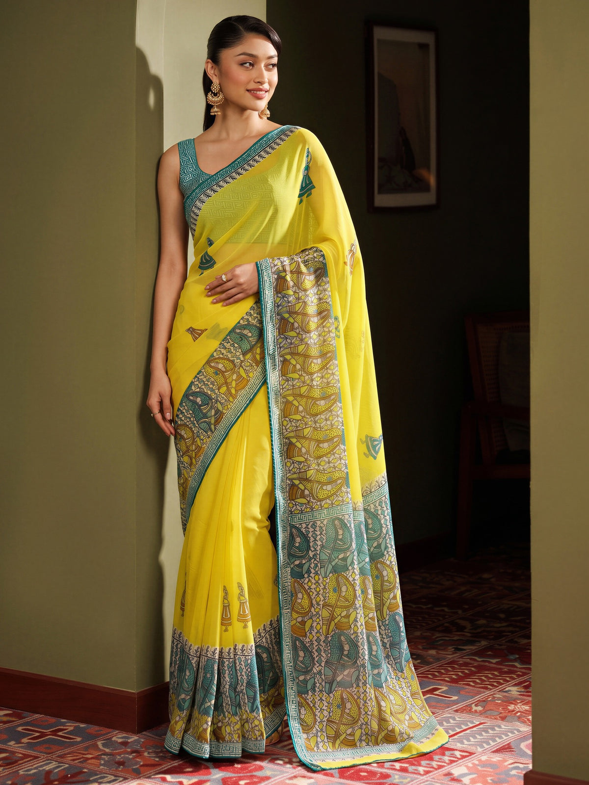 Yellow traditional prints georgette saree with light blue blouse piece
